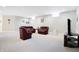 Finished basement with plush carpeting, neutral walls and comfortable seating at 3924 Bear Creek Way, Carmel, IN 46074