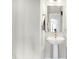 Neat powder room with pedestal sink, mirror, and minimalist design at 3924 Bear Creek Way, Carmel, IN 46074