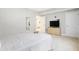 Bedroom boasts neutral colors, a dresser, and a flat screen TV, plus a view to the bathroom through an open door at 3924 Bear Creek Way, Carmel, IN 46074