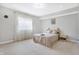 Inviting bedroom with a neutral color scheme, featuring carpeted floors and large window with sheer curtains at 3924 Bear Creek Way, Carmel, IN 46074