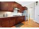 Well-lit kitchen featuring stainless steel appliances, granite countertops, and classic wood cabinetry at 3924 Bear Creek Way, Carmel, IN 46074