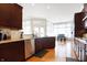 Chef's kitchen with granite countertops, stainless steel appliances, and view to breakfast nook at 3924 Bear Creek Way, Carmel, IN 46074
