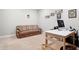 Comfortable office space with beige carpet, filled with a sofa and wooden desk with desktop computer at 3924 Bear Creek Way, Carmel, IN 46074