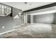 Spacious basement with neutral paint, carpeting, and door leading to another room at 4249 Dubarry Rd, Indianapolis, IN 46226