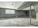 Finished basement features painted floors, ample natural light, and a support beam at 4249 Dubarry Rd, Indianapolis, IN 46226