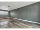 Bedroom featuring hardwood floors and modern gray walls and base trim at 4249 Dubarry Rd, Indianapolis, IN 46226