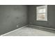 Empty bedroom featuring neutral carpet, freshly painted walls, and a window at 4249 Dubarry Rd, Indianapolis, IN 46226