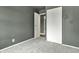 Bedroom with gray walls, carpet, an open closet and a view into another room at 4249 Dubarry Rd, Indianapolis, IN 46226