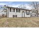 Charming two-story home with a white exterior, black shutters, and a well-manicured lawn at 4249 Dubarry Rd, Indianapolis, IN 46226