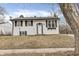 Traditional home with white siding, black shutters, and simple landscaping at 4249 Dubarry Rd, Indianapolis, IN 46226