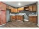 Traditional kitchen featuring wood cabinets and stainless steel sink at 4249 Dubarry Rd, Indianapolis, IN 46226