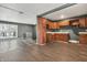 Open-concept kitchen featuring hardwood floors connecting to a modern gray room at 4249 Dubarry Rd, Indianapolis, IN 46226