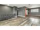 Open-concept living area featuring hardwood floors and modern gray walls at 4249 Dubarry Rd, Indianapolis, IN 46226