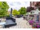 Outdoor patio with stone flooring and a relaxing lounge area with potted flowers at 501 Fletcher Ave # D, Indianapolis, IN 46203