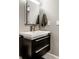 Bathroom featuring modern vanity with black drawers, a mirror, and a faucet at 501 Fletcher Ave # D, Indianapolis, IN 46203