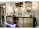This bathroom features a double sink vanity with unique stainless steel basins and a mosaic shower in the background at 501 Fletcher Ave # D, Indianapolis, IN 46203