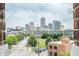 Urban view of downtown through a framed window with brick details at 501 Fletcher Ave # D, Indianapolis, IN 46203