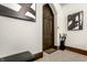 Welcoming entryway features a unique wooden door, modern art, and stylish accents at 501 Fletcher Ave # D, Indianapolis, IN 46203