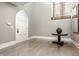 Bright entryway with a white gothic door, hardwood floors and traditional decor at 501 Fletcher Ave # D, Indianapolis, IN 46203
