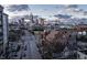 Aerial view from above a brick church with downtown buildings and a cloudy sky in the background at 501 Fletcher Ave # D, Indianapolis, IN 46203