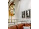 Hallway with stained-glass window, artwork, and stainless steel cable railing at 501 Fletcher Ave # D, Indianapolis, IN 46203