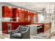 Modern kitchen with vibrant cabinetry, stainless steel appliances, and a spacious island with seating at 501 Fletcher Ave # D, Indianapolis, IN 46203