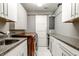 Laundry room with front load washer dryer set, cabinets and counter space at 501 Fletcher Ave # D, Indianapolis, IN 46203