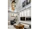 Bright living room boasts high ceilings, modern fireplace, and decorative stained glass windows at 501 Fletcher Ave # D, Indianapolis, IN 46203