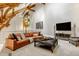 Comfortable living room area with leather sofa, stained-glass window, and neutral decor at 501 Fletcher Ave # D, Indianapolis, IN 46203