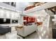 Open living space with modern kitchen, hardwood floors, and a contemporary fireplace feature at 501 Fletcher Ave # D, Indianapolis, IN 46203