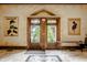 Double doors and large windows with view to landscaped exterior at 501 Fletcher Ave # D, Indianapolis, IN 46203