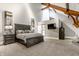 Luxurious main bedroom with vaulted ceiling, wooden beams, and stylish furnishings at 501 Fletcher Ave # D, Indianapolis, IN 46203