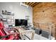 This modern office has a brick wall, floating shelves and a view of the street through the windows at 501 Fletcher Ave # D, Indianapolis, IN 46203
