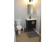 Bathroom featuring a sink, toilet and decorative mirror at 516 Northfield Dr, Lebanon, IN 46052