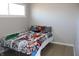 Bedroom features a large window, and a comfortable bed at 516 Northfield Dr, Lebanon, IN 46052