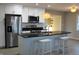 Modern kitchen with stainless steel appliances, white cabinets, a stylish island and bar stool seating at 516 Northfield Dr, Lebanon, IN 46052