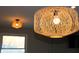 Modern pendant lights with a woven design illuminate this home's kitchen at 516 Northfield Dr, Lebanon, IN 46052