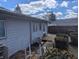 View of backyard with weathered deck, some shrubbery, and fencing visible at 5250 N Richardt Ave, Indianapolis, IN 46226
