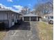 Long driveway leading to a detached two-car garage in the backyard of the home at 5250 N Richardt Ave, Indianapolis, IN 46226