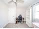 Bright bedroom featuring a ceiling fan, door, and a built-in bookshelf at 540 Barnett Ct, Whiteland, IN 46184