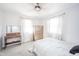 Well-lit bedroom featuring neutral decor, two windows and a dresser at 540 Barnett Ct, Whiteland, IN 46184
