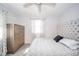 Well-lit bedroom featuring neutral decor, one window and a cushioned headboard at 540 Barnett Ct, Whiteland, IN 46184