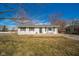 Charming single-story home featuring a well-maintained front yard and inviting entrance with chairs at 540 Barnett Ct, Whiteland, IN 46184