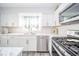Modern kitchen featuring sleek stainless steel appliances, ample counter space, and bright lighting at 540 Barnett Ct, Whiteland, IN 46184