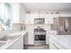 Updated kitchen featuring stainless steel appliances, white cabinets, and ample counter space at 540 Barnett Ct, Whiteland, IN 46184