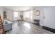 Bright living room featuring gray wood flooring, plenty of natural light, and neutral decor at 540 Barnett Ct, Whiteland, IN 46184