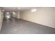 Basement features painted walls and floors, and small windows along the wall at 5502 Radnor Rd, Indianapolis, IN 46226