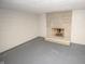 Basement features painted walls and floors, a stone fireplace and neutral tones throughout at 5502 Radnor Rd, Indianapolis, IN 46226