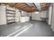 Basement features painted walls and floors, shelving, washer, dryer, and other equipment at 5502 Radnor Rd, Indianapolis, IN 46226