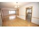 An open dining area offers hardwood floors, a pendant light, and an entry into the kitchen at 5502 Radnor Rd, Indianapolis, IN 46226